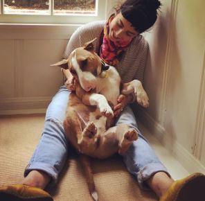 Molly Ephraim playing with her dog