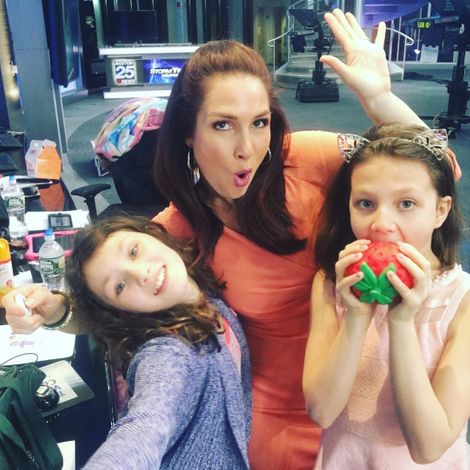 Shiri Spear at her work place with her daughters