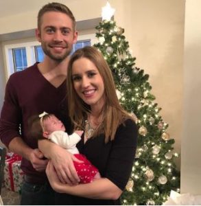 Cody Walker and his wife, Felicia with their daughter