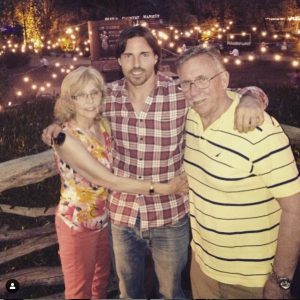 Aaron Phypers with his parents.