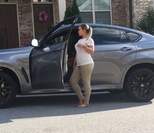 Sarah Vivan infront of her car
