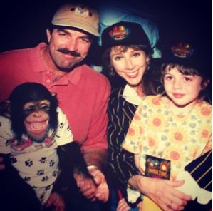 Hannah Selleck in her childhood with her parents and monkey 