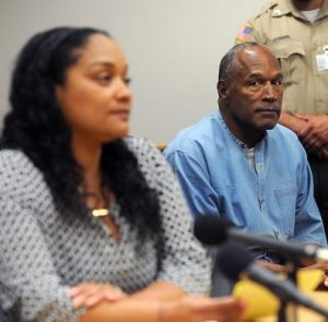OJ Simpson in the courtroom with his daughter, Arnelle Simpson