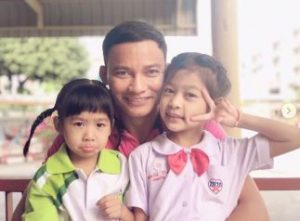 Piyarat's husband, Tony with their two daughters