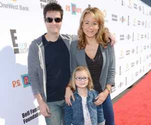 Photo of Megyn Price with her husband Edward Cotner and daughter