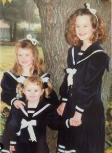 Taylor Riggs in her childhood with her sisters