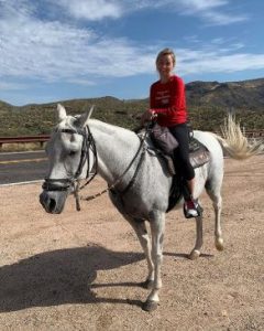 Taylor riding a horse