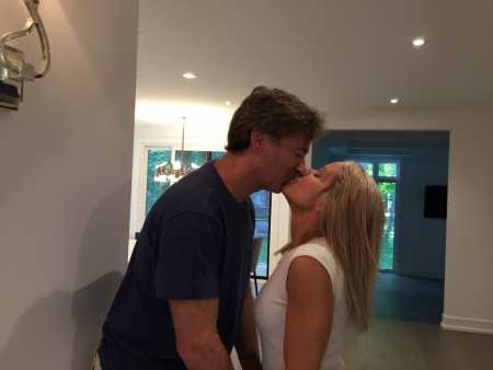 Dana Levenson kissing her boyfriend turned husband, Kevin Green