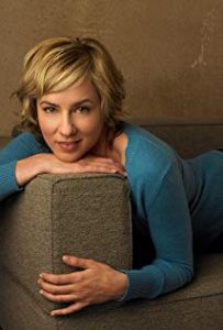 Traylor Howard is laying down while at photoshoot 