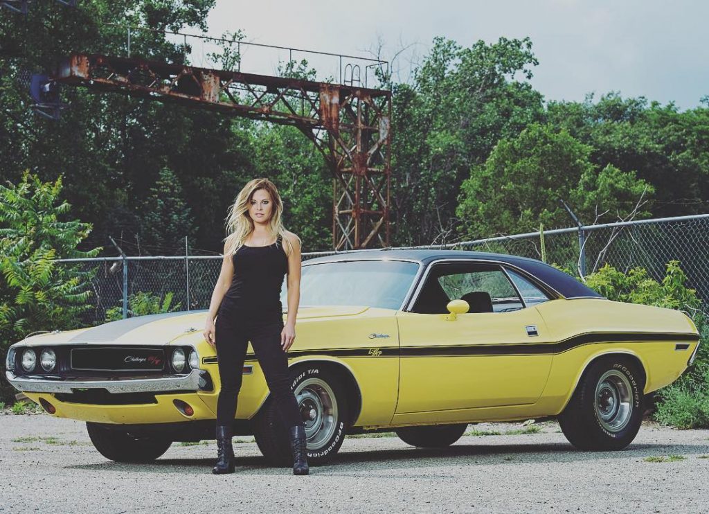 Cristy Lee posing in front of a car image