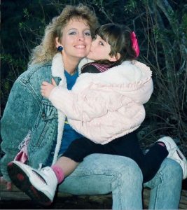 Childhood photo of Krysta Rodriguez with her mother.
