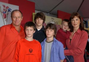 Amanda Pays and her husband with their children attending an award ceremony.