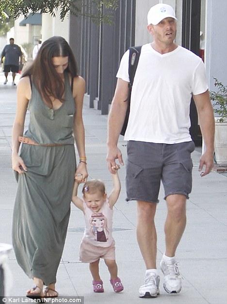 Nikki with her husband Ian and her daughter Mia