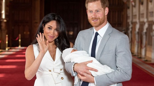 Prince Harry and Meghan Markle with their son
