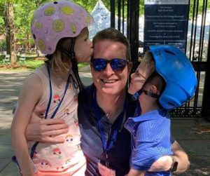 Caroline Polisi's husband with two lovely daughters