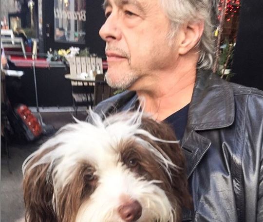 Saundra Santiago's husband and dog in Abingdon Square Park.