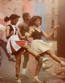 Childhood photo of Lauren Velez while dancing on the stage.