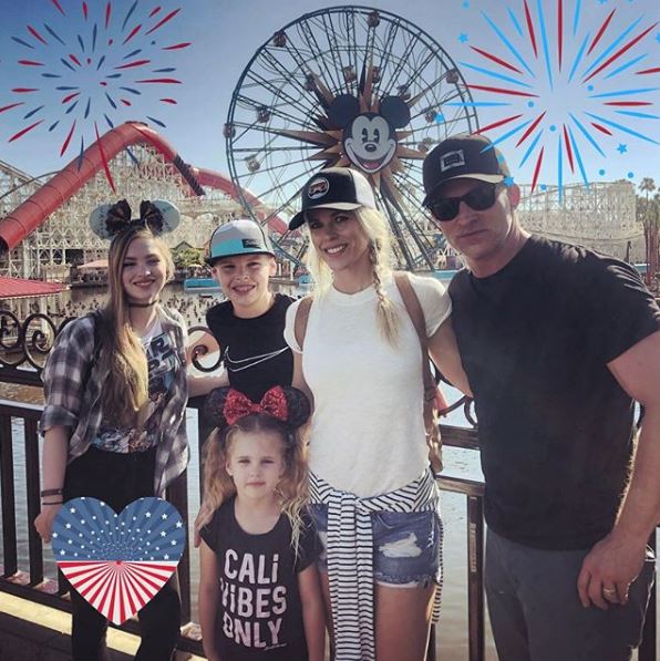 Steve Burton visiting Disneyland with his wife and children.