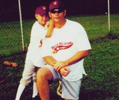 Childhood photo of Lucas Adams with his father.