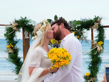 Lawrence Faulborn kissing his bride