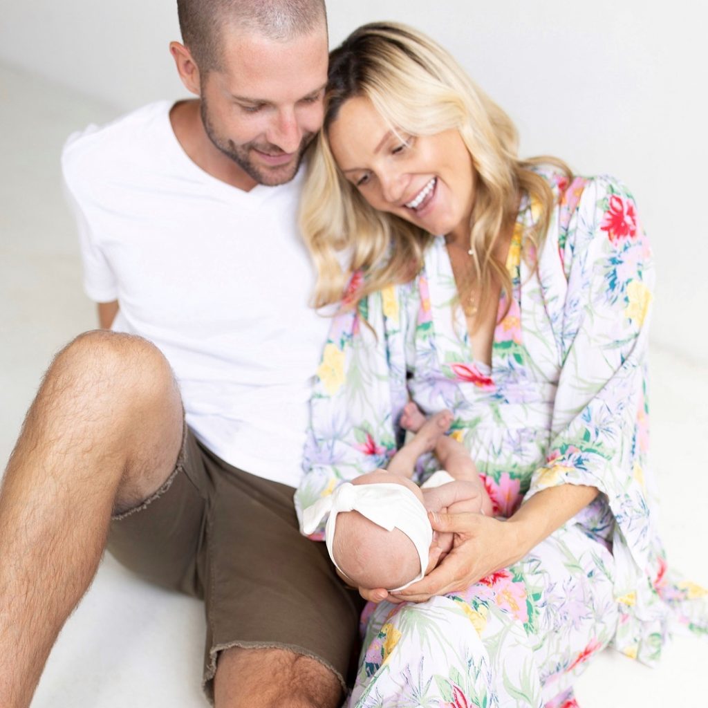 Kevin and his spouse with their daughter, Tatum Woods