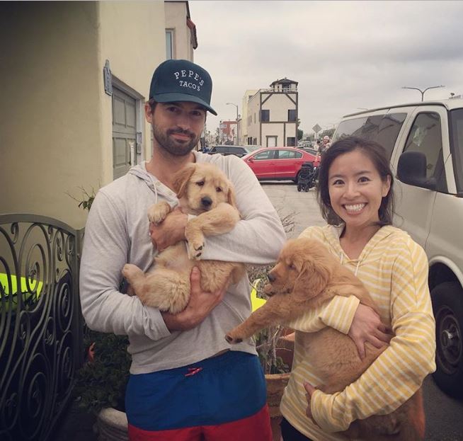 Melody Peng and her love partner, Steven Lee Busby with their pet dogs.