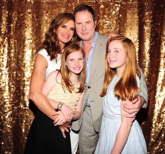 Christopher Henchy with his wife, Brooke and their two daughters, Rowan and Grier.