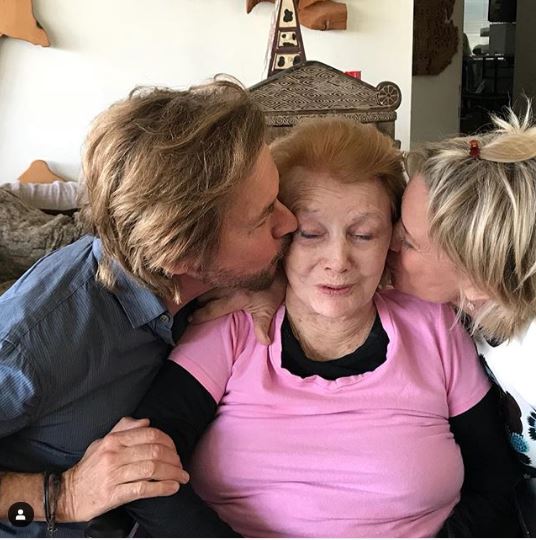 Peggy McCay's Days of Our Lives co-stars kissing her on the chicks.