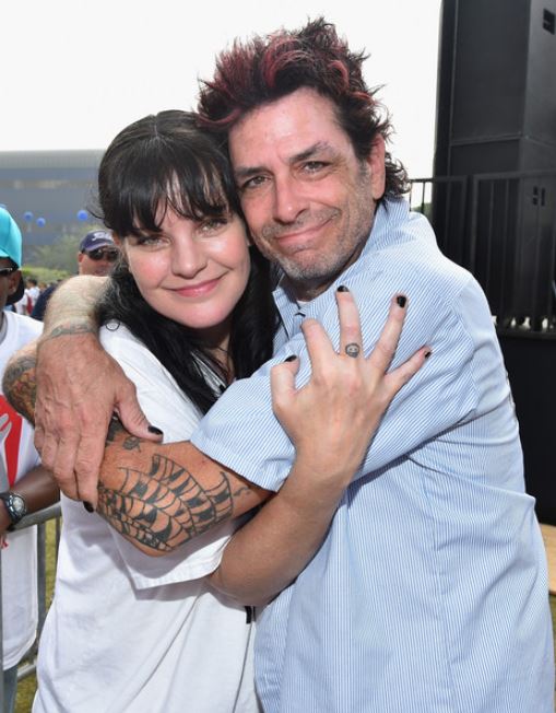 Dick Donato with his friend, Pauley Perrette hugging each other at the 30th Annual AIDS Walk Los Angeles on 12th October 2014, in West Hollywood, California.