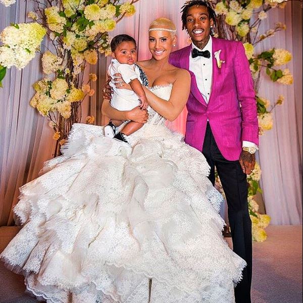 Wiz Khalifa and Amber Rose's son, Sebastian Taylor Thomaz holding him in her arms at their wedding ceremony.
