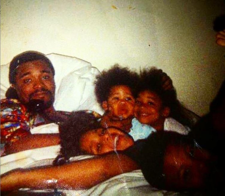 Childhood photo of Lee Daniels with his late father and siblings.