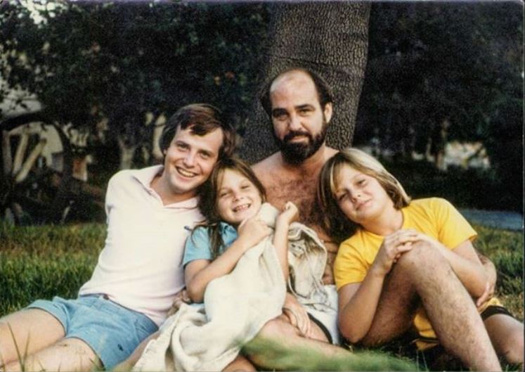 Childhood photo of Daniela Sea with her father and siblings.