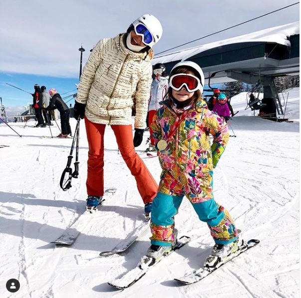 Julee Cerda skiing with her daughter in Snowmass, Colorado.