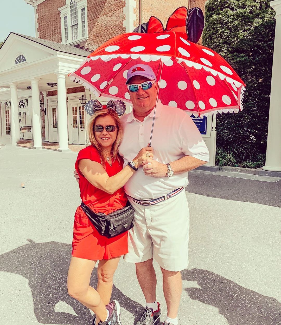  an American sports commentator look happy with his wife