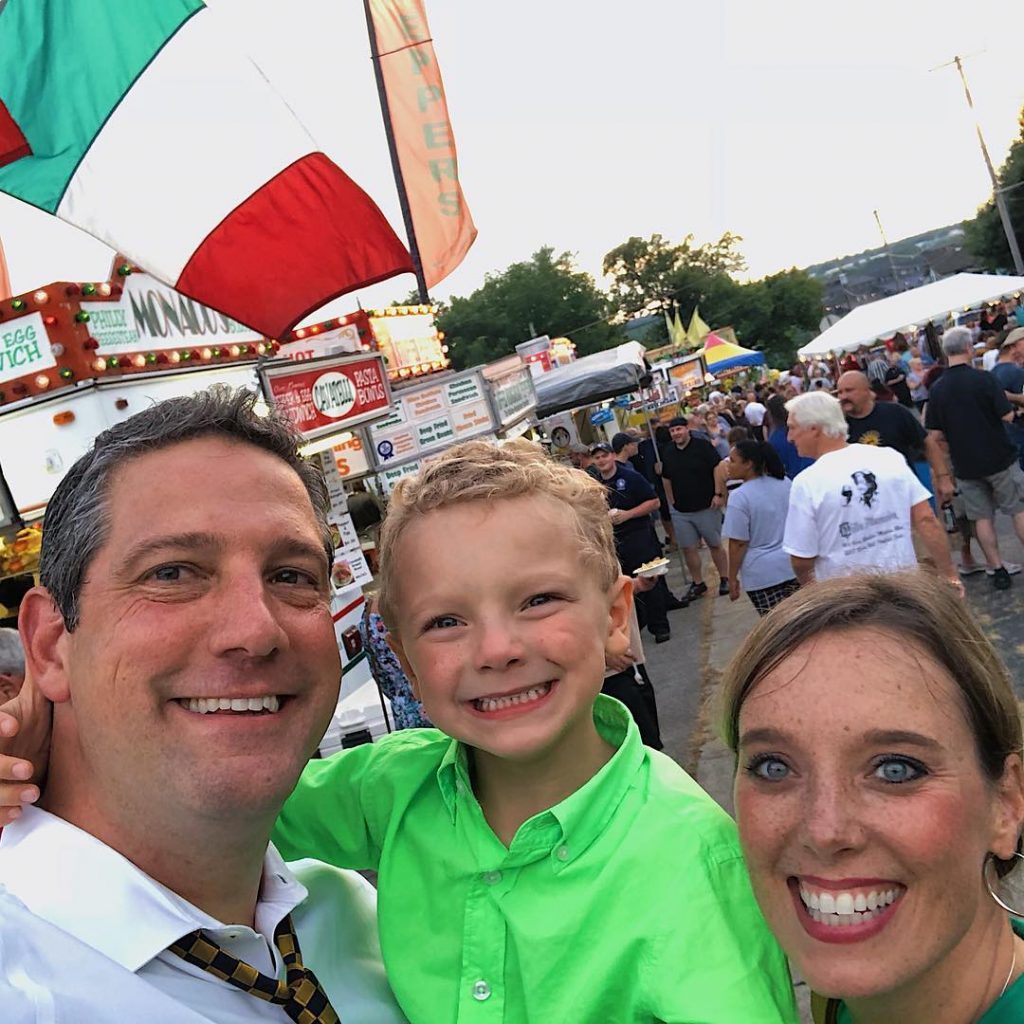 Tim Ryan with his child and wife