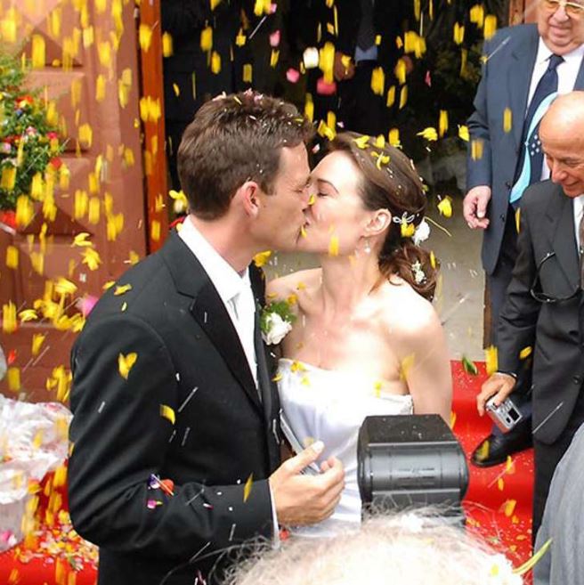 Dougray Scott and his wife Claire Antonia Forlani kissing each other at their wedding in Italy.