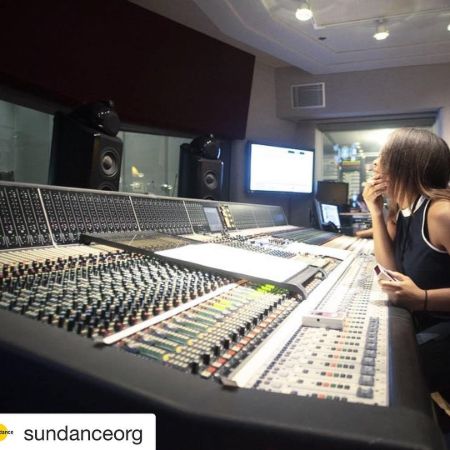 Dara concentrating on her work at a studio