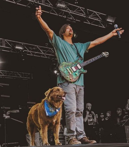 Scott Woodruff while in a concert with his pet dog