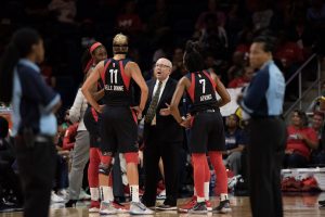 Mike instructing his players during the break.