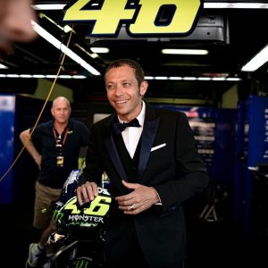 Rossi posing with his racing bike.