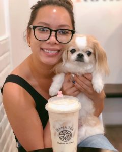 Brigette holding her dog Mimi.