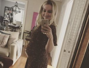 Allie Wood showing off her baby bump