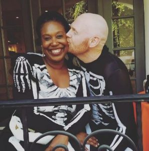 Bill Burr kissing his wife, Nia Hill