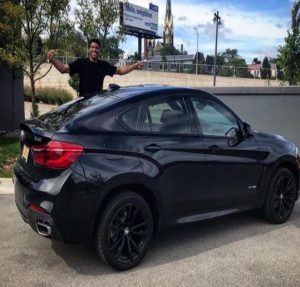 Giannis Antetokounmpo along with his extortionate black car