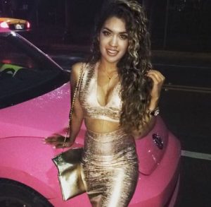 Nikki Glamour along with her pink car