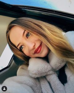 Sophia Diamond captures a picture in her car