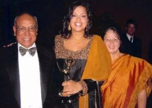 Sukanya Krishnan with her parents after winning an Emmy in 2006