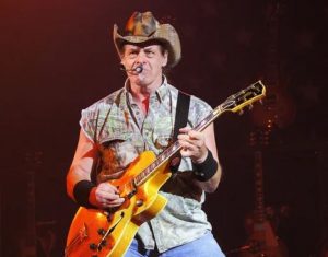 Ted Nugent performing in a concert