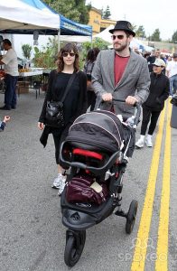 Stacy and Eddie were seen with a baby carriage at one time.