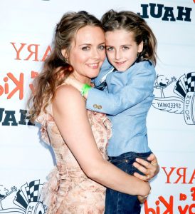 Bear blue with her mother during an event. 